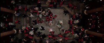 Movie still from “The Four Feathers” (2002), directed by Shekhar Kapur – An overhead view of a group of people dancing; Extreme Wide shot, Overhead angle