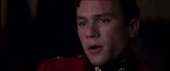 Movie still from “The Four Feathers” (2002), directed by Shekhar Kapur – A person wearing a military uniform; Close Up shot, High angle