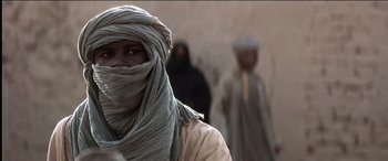 Movie still from “The Four Feathers” (2002), directed by Shekhar Kapur – A man in a turban and a woman in a burka; Close Up shot, Low angle