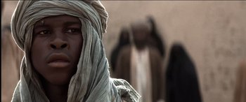 Movie still from “The Four Feathers” (2002), directed by Shekhar Kapur – A man with a beard and a head covering; Close Up shot, Low angle