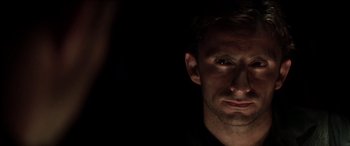 Movie still from “The Four Feathers” (2002), directed by Shekhar Kapur – A person in a dark room; Extreme Close Up shot, Over the shoulder angle