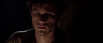 Movie still from “The Four Feathers” (2002), directed by Shekhar Kapur – A person looking at the camera; Close Up shot, High angle