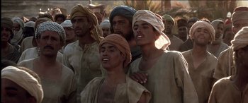 Movie still from “The Four Feathers” (2002), directed by Shekhar Kapur – A group of men standing next to each other; Medium shot, Low angle