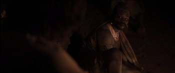 Movie still from “The Four Feathers” (2002), directed by Shekhar Kapur – A man sitting on the ground in the dark; Close Up shot, High angle