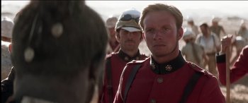 Movie still from “The Four Feathers” (2002), directed by Shekhar Kapur – A group of men standing next to each other in uniforms; Close Up shot, Over the shoulder angle