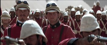 Movie still from “The Four Feathers” (2002), directed by Shekhar Kapur – A group of men in red and white uniforms; Close Up shot, Low angle