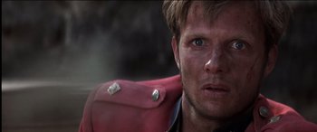 Movie still from “The Four Feathers” (2002), directed by Shekhar Kapur – A man's face in a red jacket; Close Up shot, Over the shoulder angle