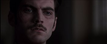 Movie still from “The Four Feathers” (2002), directed by Shekhar Kapur – A person with a mustache; Close Up shot, Over the shoulder angle
