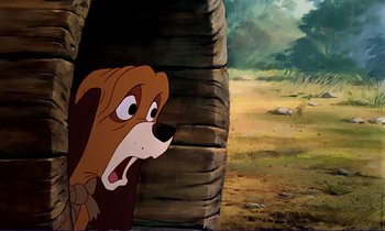 Movie still from “The Fox and the Hound” (1981), directed by Richard Rich – A cartoon of a dog looking out of a barrel; Close Up shot, Low angle