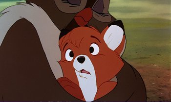 Movie still from “The Fox and the Hound” (1981), directed by Richard Rich – A fox's face in a cartoon; Close Up shot, Over the shoulder angle