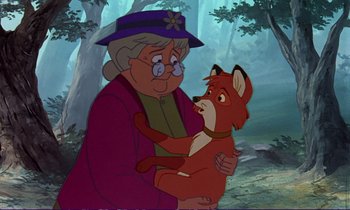 Movie still from “The Fox and the Hound” (1981), directed by Richard Rich – An old woman holding onto a small dog; Close Up shot, Over the shoulder angle