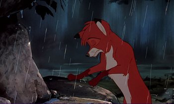 Movie still from “The Fox and the Hound” (1981), directed by Richard Rich – A fox standing in the middle of a rain storm; Medium shot, High angle