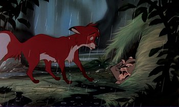 Movie still from “The Fox and the Hound” (1981), directed by Richard Rich – An animated scene of a red fox chasing another animal in the rain; Wide shot, Over the shoulder angle