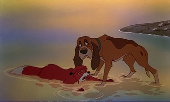 Movie still from “The Fox and the Hound” (1981), directed by Richard Rich – A dog and a red dog in a pool of water; Wide shot, Low angle