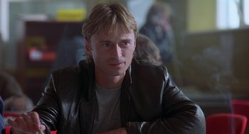 Movie still from “The Full Monty” (1997), directed by Peter Cattaneo – A person wearing a leather jacket; Close Up shot, Over the shoulder angle