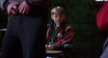 Movie still from “The Full Monty” (1997), directed by Peter Cattaneo – A young boy sitting in front of a drum; Medium shot, Over the shoulder angle