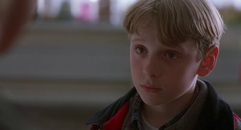 Movie still from “The Full Monty” (1997), directed by Peter Cattaneo – A young boy is looking into the distance; Close Up shot, Low angle
