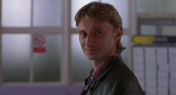 Movie still from “The Full Monty” (1997), directed by Peter Cattaneo – A person wearing a jacket; Close Up shot, Over the shoulder angle