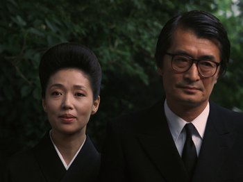 A man and a woman standing next to each other