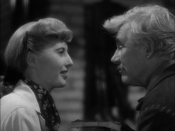 Movie still from “The Furies” (1950), directed by Anthony Mann – An older man and a younger woman talking to each other; Close Up shot, Over the shoulder angle