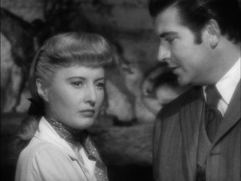 Movie still from “The Furies” (1950), directed by Anthony Mann – A man and a woman standing next to each other; Close Up shot, Over the shoulder angle