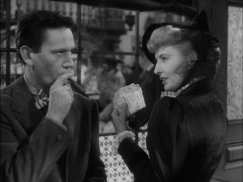 Movie still from “The Furies” (1950), directed by Anthony Mann – A man and a woman standing next to each other in front of a building; Close Up shot, Low angle