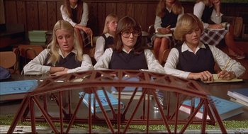 Movie still from “The Fury” (1978), directed by Brian De Palma – A group of young people sitting in a room; Medium shot, Low angle