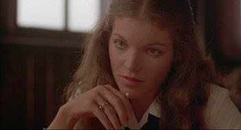 Movie still from “The Fury” (1978), directed by Brian De Palma – A person with a ring on her finger; Close Up shot, Over the shoulder angle
