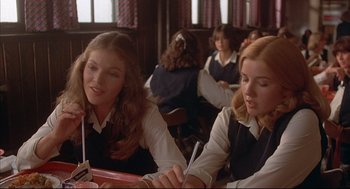 Movie still from “The Fury” (1978), directed by Brian De Palma – Two women sitting at a table in front of each other; Medium shot, Over the shoulder angle