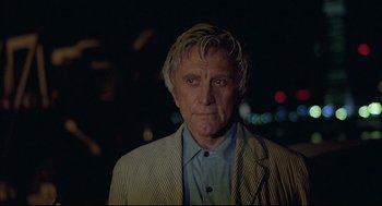 Movie still from “The Fury” (1978), directed by Brian De Palma – An older man wearing a suit and tie; Close Up shot, Low angle