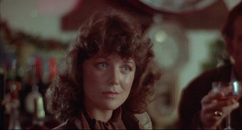 Movie still from “The Fury” (1978), directed by Brian De Palma – A person with long hair; Close Up shot, Over the shoulder angle