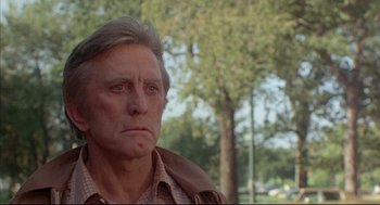 Movie still from “The Fury” (1978), directed by Brian De Palma – An older man with a beard and a jacket on; Close Up shot, Low angle