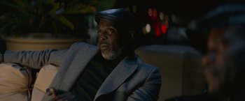 Movie still from “The Gambler” (2014), directed by Rupert Wyatt – A man wearing a hat and a jacket; Close Up shot, Low angle