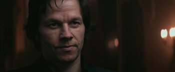 Movie still from “The Gambler” (2014), directed by Rupert Wyatt – A person wearing a black shirt; Close Up shot, Over the shoulder angle