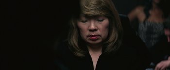 Movie still from “The Gambler” (2014), directed by Rupert Wyatt – A person with her eyes closed; Close Up shot, High angle