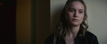 Movie still from “The Gambler” (2014), directed by Rupert Wyatt – A woman with long blonde hair wearing a black shirt; Close Up shot, Over the shoulder angle