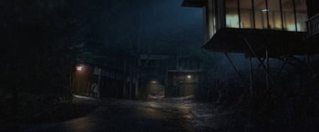 Movie still from “The Gambler” (2014), directed by Rupert Wyatt – A dark street with a lot of lights on it; Extreme Wide shot, High angle