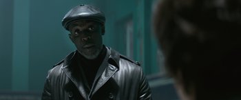 Movie still from “The Gambler” (2014), directed by Rupert Wyatt – A man wearing a leather jacket and a hat; Close Up shot, Low angle