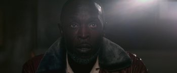 Movie still from “The Gambler” (2014), directed by Rupert Wyatt – A person wearing a jacket; Extreme Close Up shot, High angle