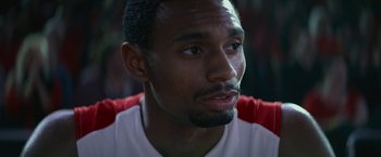 Movie still from “The Gambler” (2014), directed by Rupert Wyatt – A man's face in a red and white shirt; Close Up shot, Over the shoulder angle