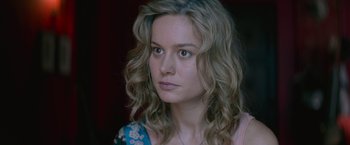 Movie still from “The Gambler” (2014), directed by Rupert Wyatt – A person with long blonde hair; Close Up shot, Over the shoulder angle