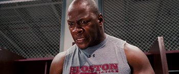 Movie still from “The Game Plan” (2007), directed by Andy Fickman – A person wearing a t - shirt; Close Up shot, Low angle