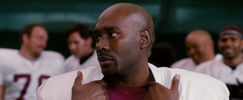 Movie still from “The Game Plan” (2007), directed by Andy Fickman – A person wearing a white shirt; Close Up shot, Over the shoulder angle