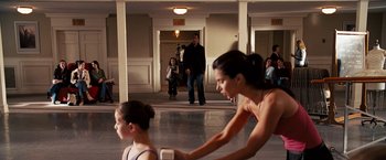 Movie still from “The Game Plan” (2007), directed by Andy Fickman – A woman and a child are in a room; Medium shot, Over the shoulder angle