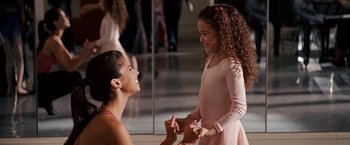 Movie still from “The Game Plan” (2007), directed by Andy Fickman – A woman and a little girl are smiling at each other; Medium shot, Over the shoulder angle