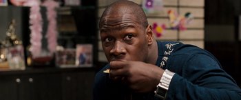 Movie still from “The Game Plan” (2007), directed by Andy Fickman – A person with his hand to his mouth; Close Up shot, Over the shoulder angle