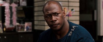 Movie still from “The Game Plan” (2007), directed by Andy Fickman – A person wearing a blue t - shirt; Close Up shot, Low angle