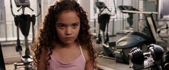Movie still from “The Game Plan” (2007), directed by Andy Fickman – A little girl in a pink shirt in a gym; Close Up shot, High angle