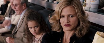 Movie still from “The Game Plan” (2007), directed by Andy Fickman – A woman sitting next to a little girl on a bus; Close Up shot, Over the shoulder angle