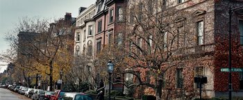 Movie still from “The Game Plan” (2007), directed by Andy Fickman – A row of houses on a street with a tree in front of them; Extreme Wide shot, High angle